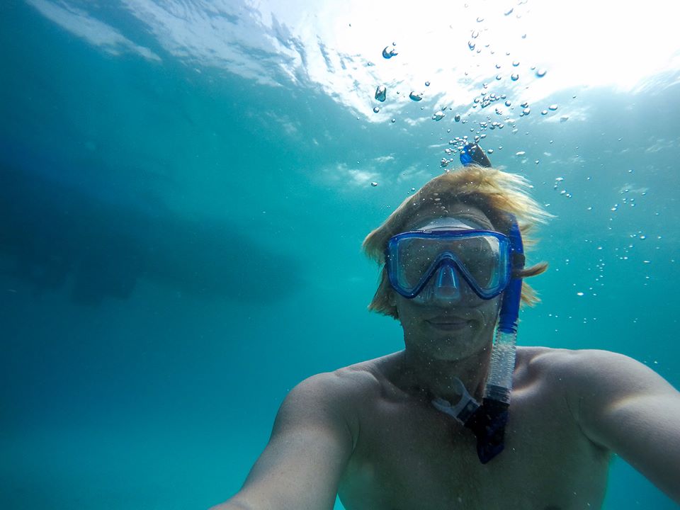 Sander, founder of Aloha Tours Mexico, snorkeling in the Caribbean